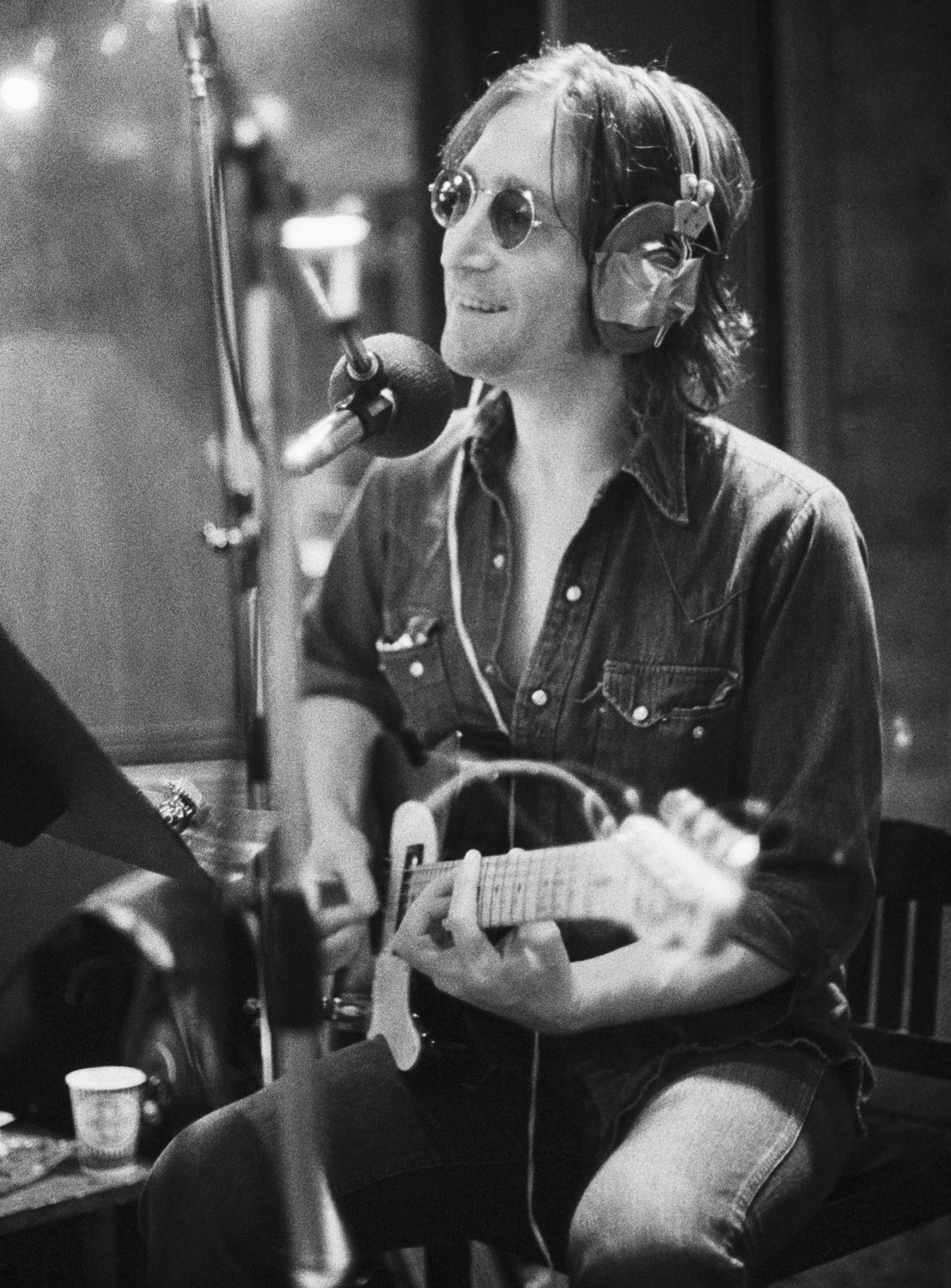 John Lennon recording "Walls and Bridges" at the Record Plant, NYC. 1974. Please contact Bob Gruen's studio to purchase a print or license this photo. email: nfo@bobgruen.com